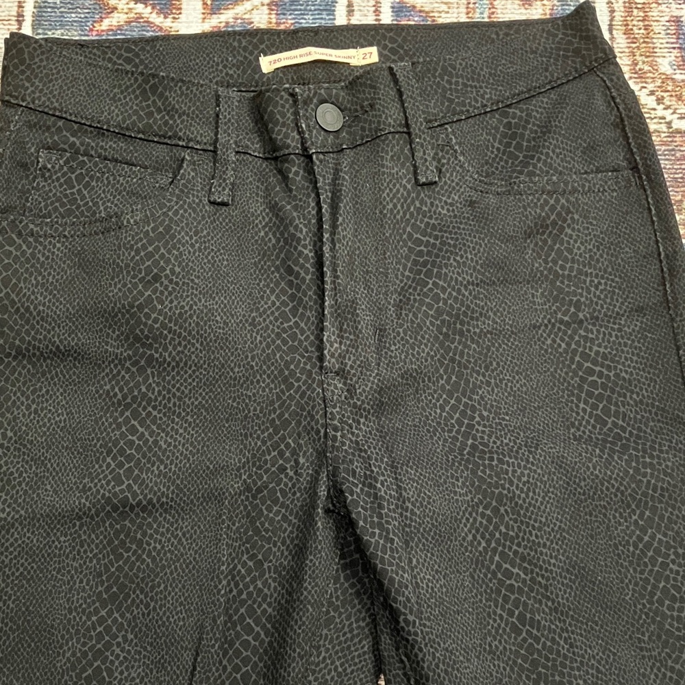 Levi’s black with snake pattern skinny jeans
